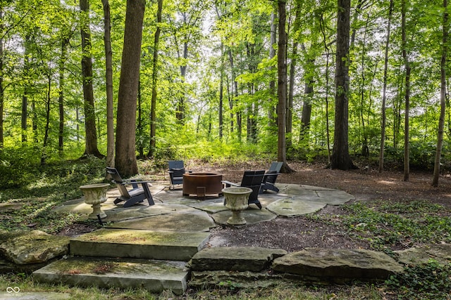 view of patio / terrace with a fire pit