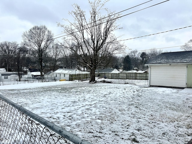 view of yard layered in snow