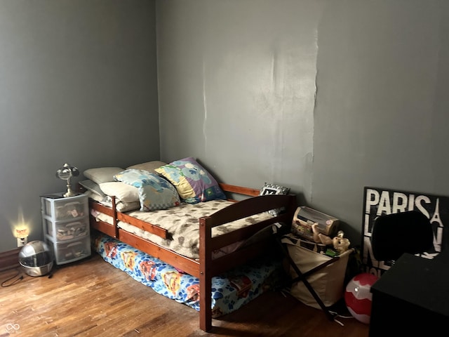 bedroom with wood-type flooring