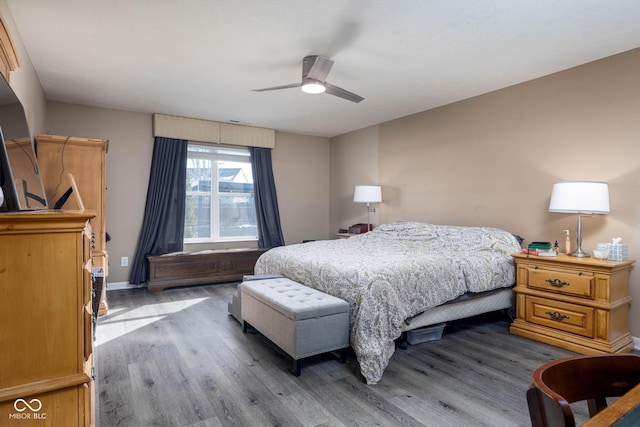 bedroom featuring ceiling fan and light hardwood / wood-style flooring