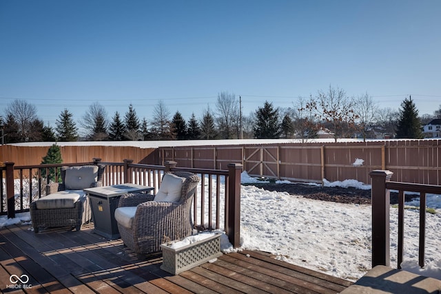 view of snow covered deck