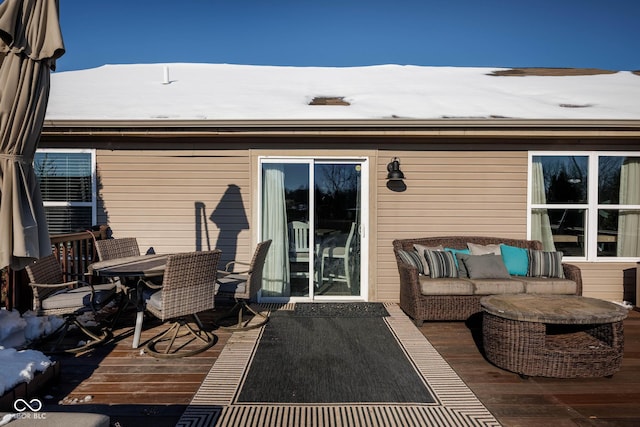 wooden deck with an outdoor hangout area