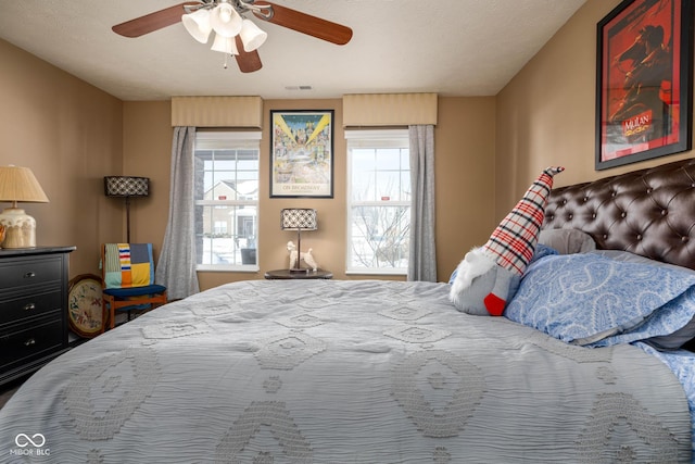 bedroom featuring a textured ceiling and ceiling fan