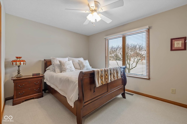 bedroom featuring ceiling fan and light colored carpet