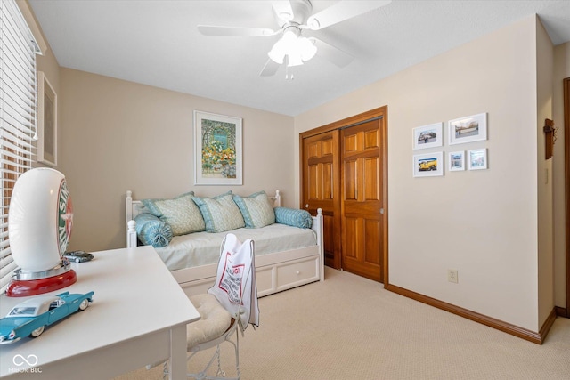 living room featuring ceiling fan, light colored carpet, and a healthy amount of sunlight