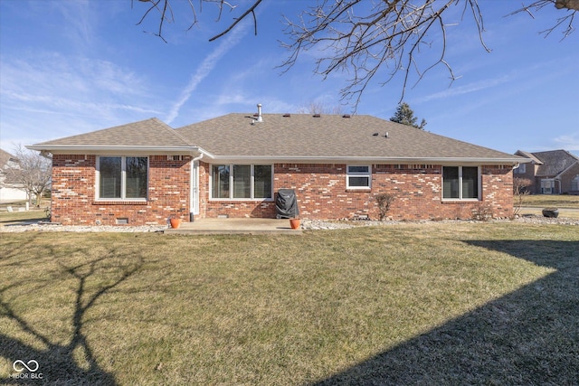 back of property with a yard and a patio area