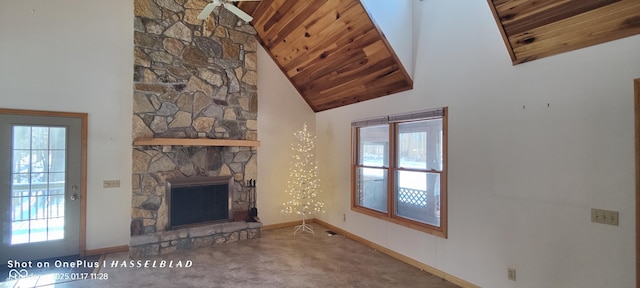 unfurnished living room with wood ceiling, carpet flooring, a fireplace, and high vaulted ceiling