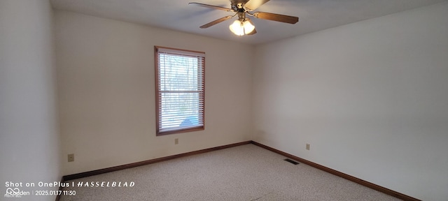 empty room with ceiling fan and carpet flooring