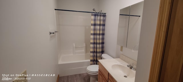 full bathroom with shower / tub combo with curtain, vanity, toilet, and hardwood / wood-style floors