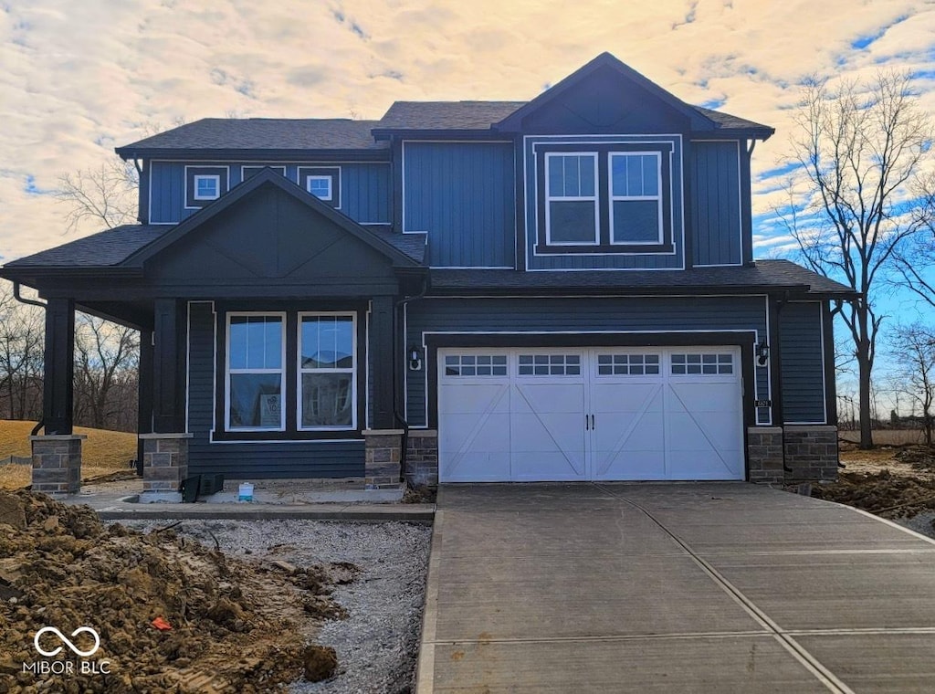 craftsman inspired home with a garage