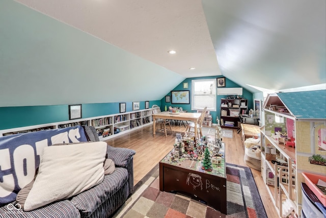 interior space with vaulted ceiling and hardwood / wood-style floors