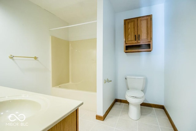 bathroom featuring tile patterned floors, vanity, and toilet