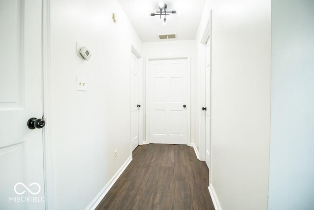 hall featuring dark wood-type flooring