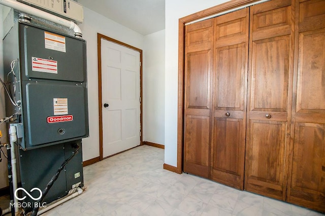 utility room featuring heating unit