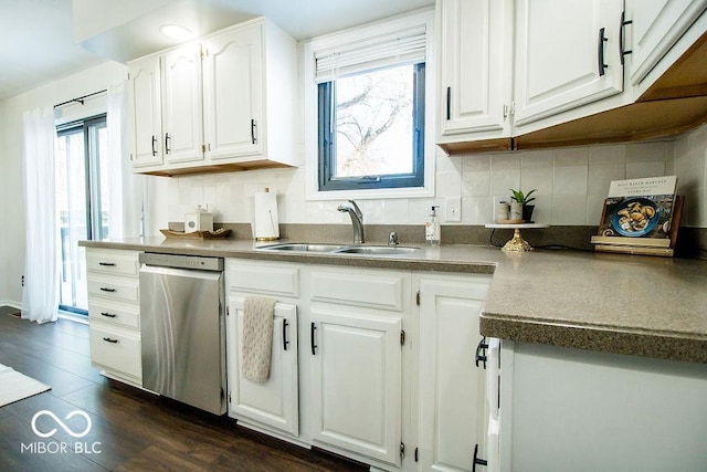 kitchen featuring sink, white cabinets, dishwasher, and plenty of natural light