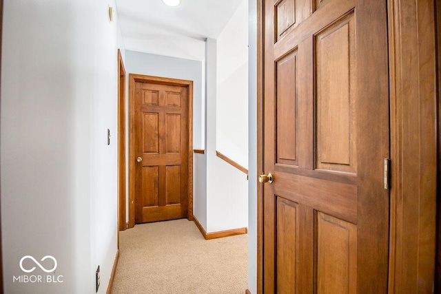 hallway featuring light carpet