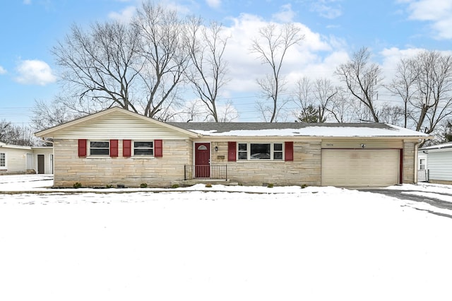 ranch-style house featuring a garage