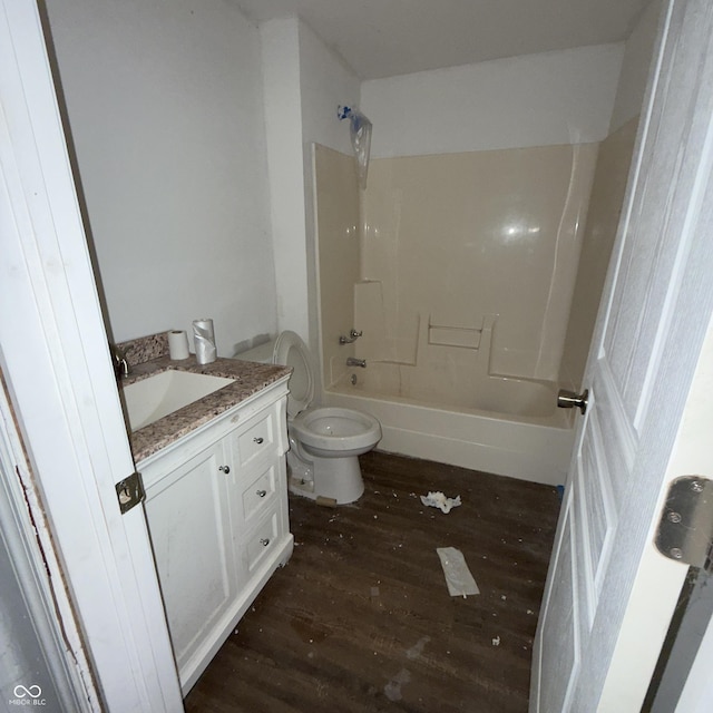 full bathroom with toilet, vanity, hardwood / wood-style floors, and bathing tub / shower combination