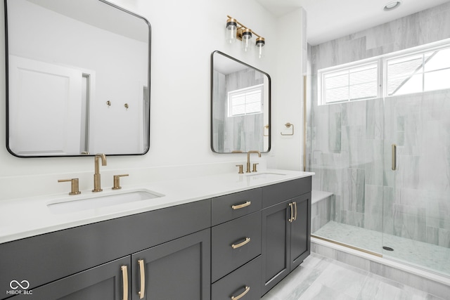 bathroom featuring vanity, plenty of natural light, and walk in shower