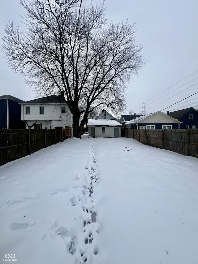 view of yard covered in snow