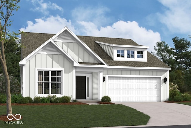 view of front of home with a garage and a front lawn