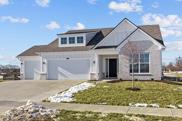 view of front of home with a garage and a front yard