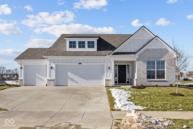 view of front facade with a garage and a front lawn