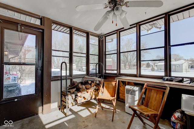 sunroom / solarium with ceiling fan