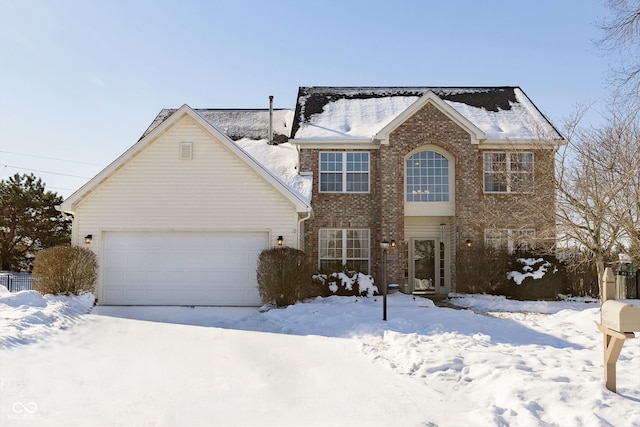 colonial home featuring a garage