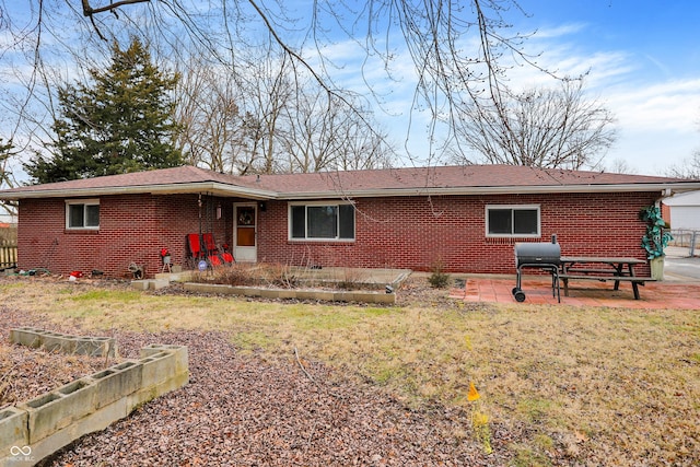 back of house featuring a yard and a patio area