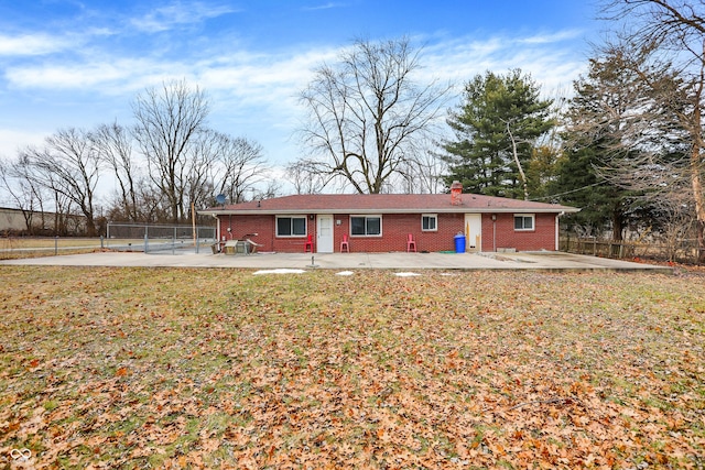 back of house featuring a yard and a patio