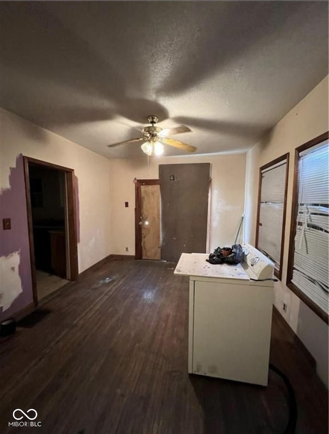 kitchen featuring a textured ceiling, ceiling fan, and dark hardwood / wood-style flooring