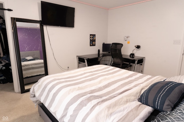 bedroom with light colored carpet