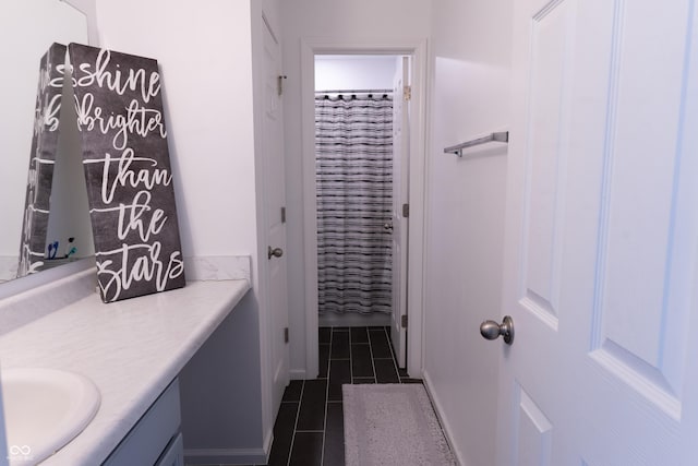 bathroom featuring vanity, tile patterned flooring, and a shower with curtain