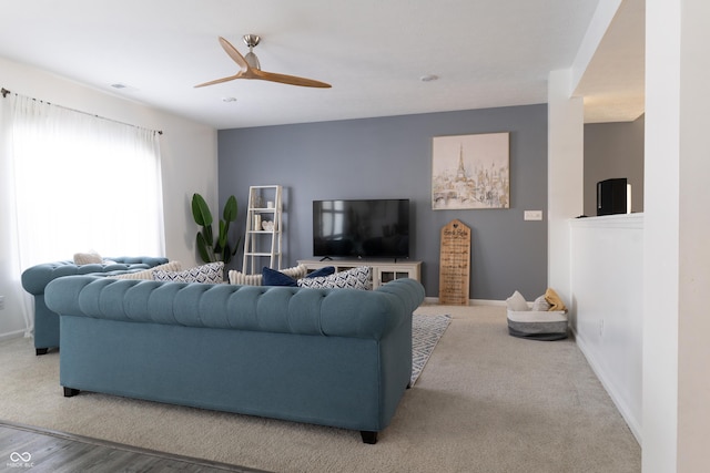 living room with carpet and ceiling fan