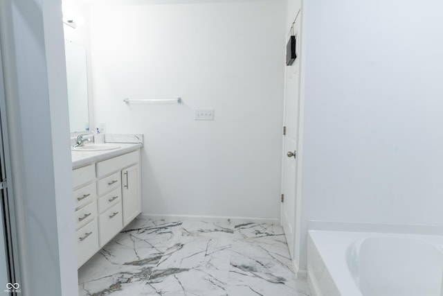 bathroom with vanity and a bathing tub