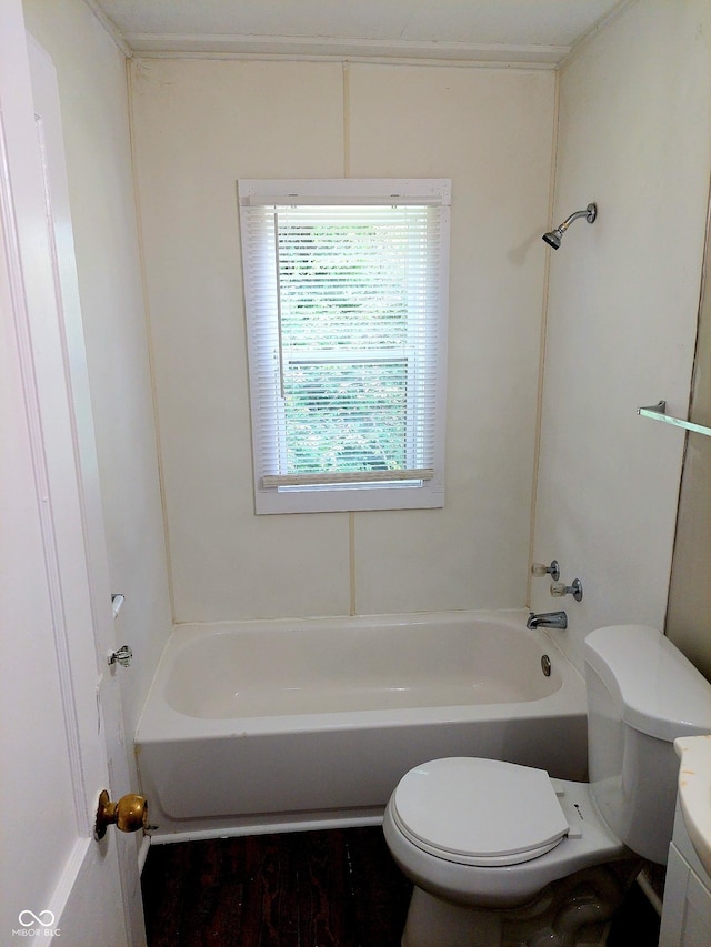 bathroom with toilet and washtub / shower combination