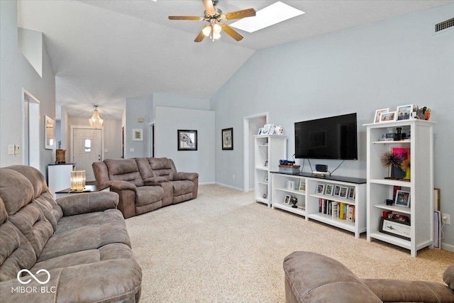 living room featuring lofted ceiling, ceiling fan, and carpet flooring