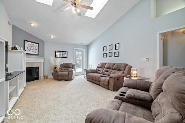 living room with ceiling fan, carpet flooring, and high vaulted ceiling