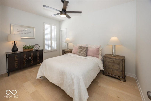 bedroom with ceiling fan and light hardwood / wood-style floors