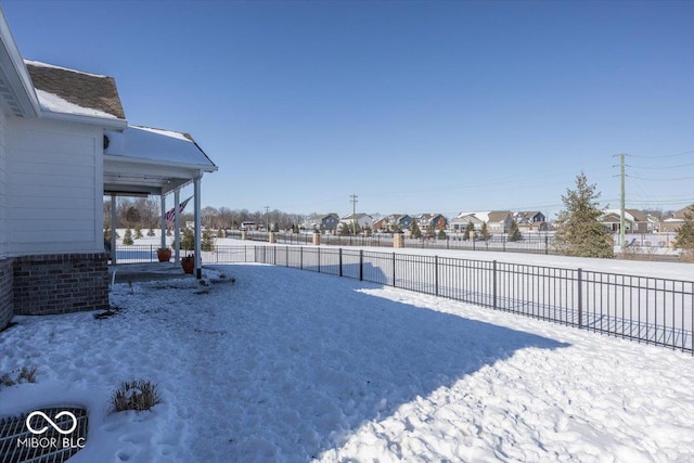 view of yard covered in snow