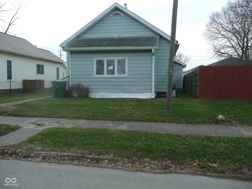 view of home's exterior with a lawn