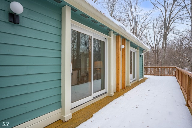 view of side of home with a deck