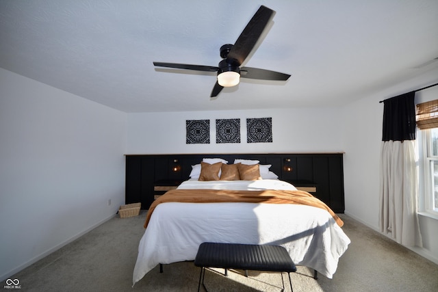 carpeted bedroom with ceiling fan and multiple windows