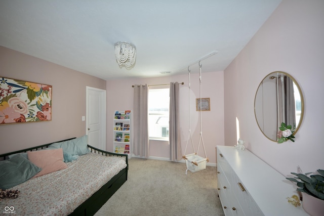 bedroom featuring light carpet