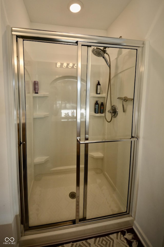 bathroom with an enclosed shower