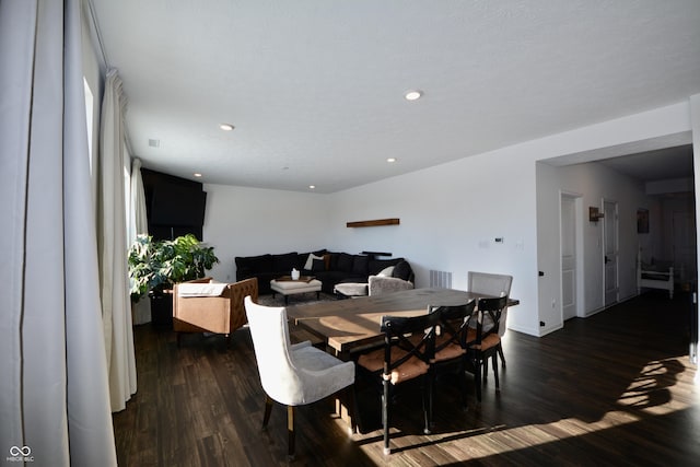 dining space with dark hardwood / wood-style floors