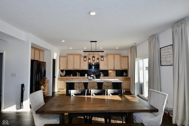 dining space featuring wood-type flooring