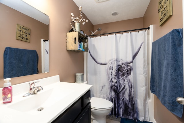 full bathroom with a textured ceiling, toilet, vanity, and shower / bath combination with curtain