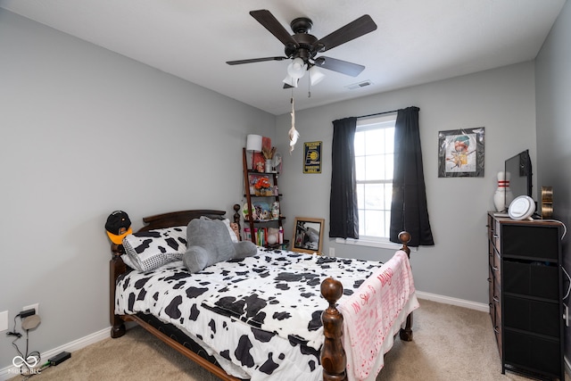 bedroom with ceiling fan and carpet floors